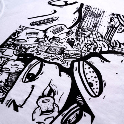 close-up view of a screen printed black graphic by the artist RubeZilla on a white T-shirt; a shifting field of faces with various expressions