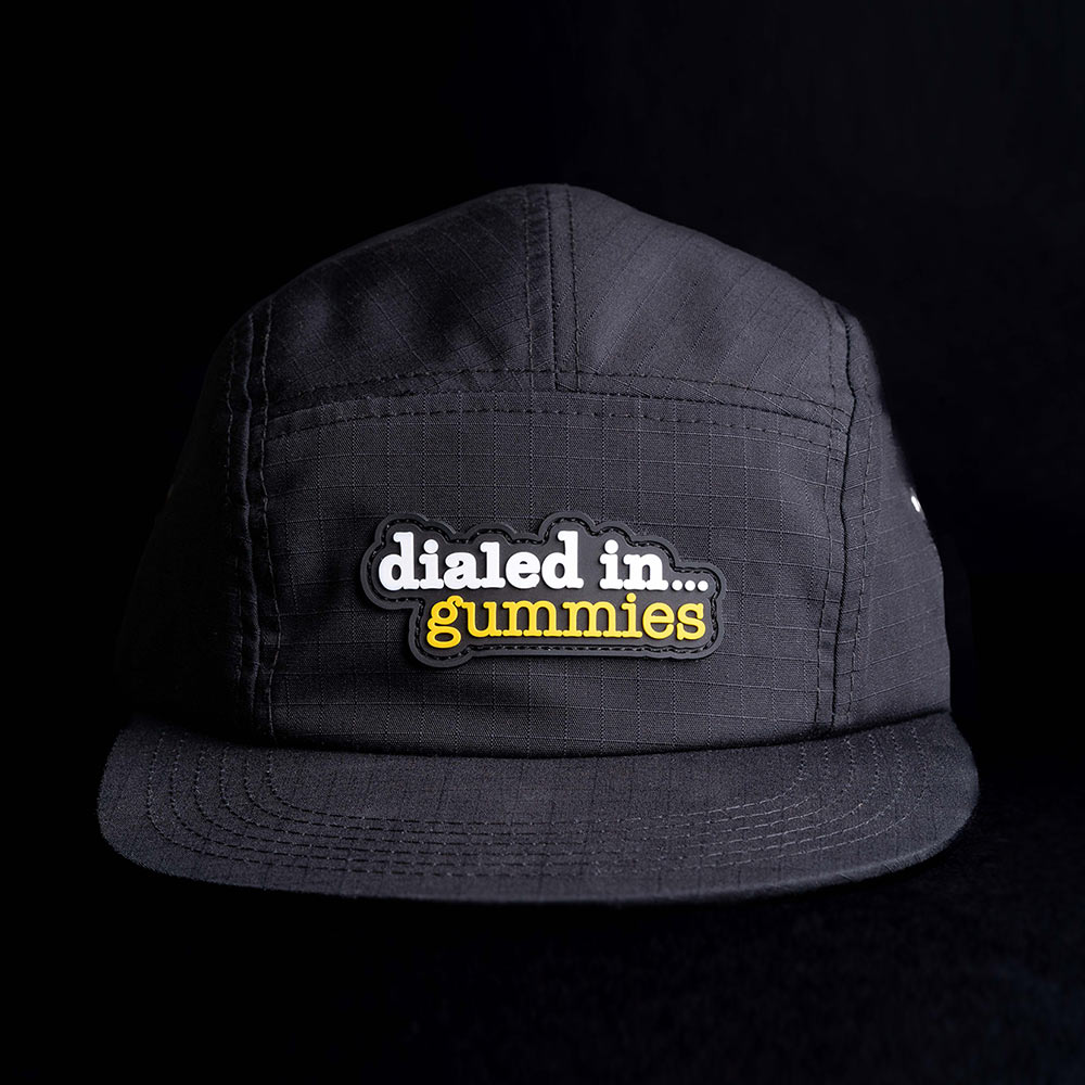 black ripstop 5-panel hat with a dialed in... gummies rubber label