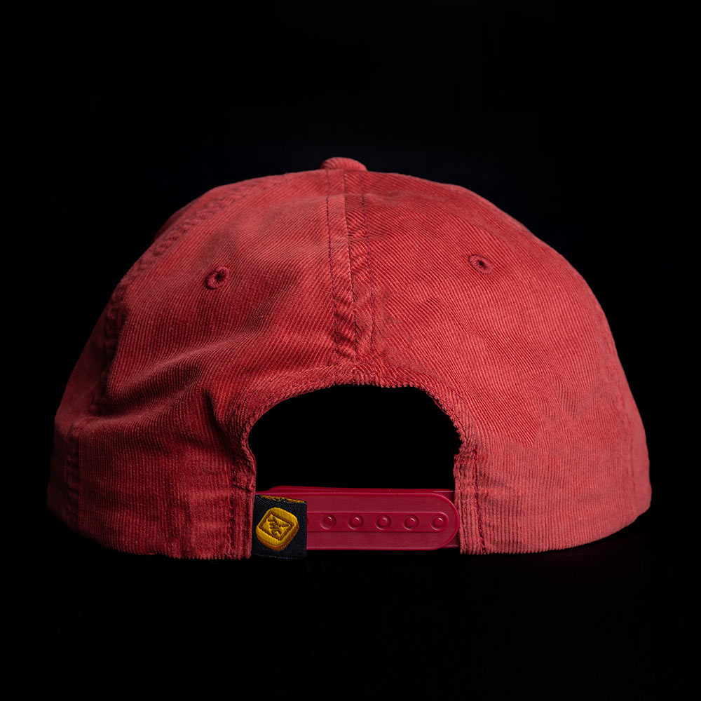rear view of a maroon hat with a yellow gummy sewn label
